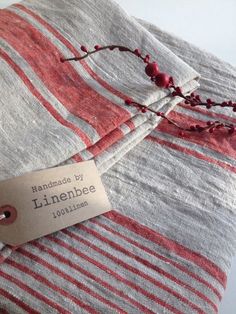 a label on a red and white striped blanket