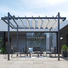 an outdoor living area with patio furniture and pergolated roof