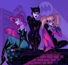 three women dressed up as batman and catwoman sitting on a brick wall in front of a cityscape