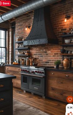 a kitchen with brick walls and wooden floors