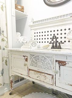 a bathroom with a sink, mirror and shower curtain in it's center area