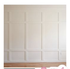 an empty room with white walls and wood floors