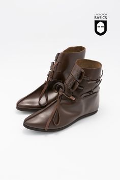 These Viking half boots are made from leather and feature a complex closure for a secure fit. This consists of two flaps and a knot at the front of the shoe for a secure fit as well as a stylish appearance. These are perfect for reenactments or historically inspired character concepts. Color: Dark Brown Includes Sole Triquetra Pendant, Viking Shoes, Paracord Armband, Half Boots, Ragnar Lothbrok, Black Week, Viking Jewelry, Ring Size Guide, Bushcraft