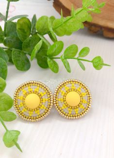 "Yellow beadwork earrings. Round beaded stud with rhinestone. Earrings inspired by Native style are handmade from Japanese beads Toho, using felt, a strong synthetic thread, nickel-free clasp, rhinestone chain, and leatherette. Measurements: Diameter earrings ≈ 1,25\" You can see more colors here: https://www.etsy.com/listing/1291802643/beadwork-stud-native-style-earrings It will be a great gift, I send all jewelry in gift wrapping. Please note: do not wear beaded jewelry during active sports, swimming, and sunbathing. Do not put perfume and other cosmetics on bead jewelry. Real colors may slightly differ from one on the monitor to another, as it depends on specific monitor settings. You can also order earrings in the colors you like! Thank You for visiting my store! Please, don't hesitate Yellow Beaded Earrings Native American, Yellow Round Bead Jewelry For Summer, Yellow Round Beads Jewelry For Summer, Traditional Yellow Earrings For Summer, Gold Round Beaded Earrings For Summer, Yellow Round Beaded Earrings For Gifts, Handmade Yellow Circular Jewelry, Handmade Yellow Beaded Round Earrings, Beaded Round Clip-on Earrings