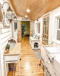 the inside of a house with wood floors and white walls