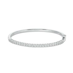 Simple and sophisticated, this diamond bangle bracelet pairs well with most any attire. Crafted in sterling silver, this refined design features a row of diamonds, each artfully set to enhance size and sparkle. Radiant with 1/4 ct. t.w. of diamonds and a brilliant buffed luster, this bracelet measures 7.0 inches in circumference and secures with a tongue and groove clasp. Classic Diamond Pave Bangle Bracelet, Classic White Gold Diamond Bracelet With Pave Setting, Diamond Channel Set Bangle For Anniversary, Anniversary Diamond Bangle With Channel Set, Elegant Diamond Channel Set Bangle, White Gold Channel Set Diamond Bracelet, White Gold Diamond Accents Bangle Bracelet, White Gold Diamond Accents Bangle, Modern White Gold Diamond Bangle With Diamond Accents