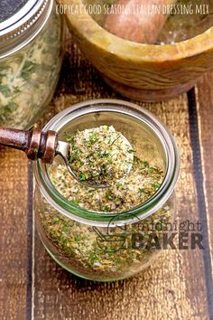 a jar filled with food sitting on top of a wooden table