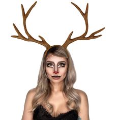 a woman with deer antlers on her head is wearing a black dress and makeup