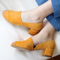 Step back in time with these vintage mustard vegan suede pumps. Featuring a peep-toe and cut-out design, with a comfortable block heel. Elegant, comfortable, and cruelty-free, perfect for any occasion. Color: Mustard Material: Vegan suede Heel Type: Block heel Heel height: 2" / 50 mm approx Product measurements were taken using size 8. Please note that measurements may vary by size. Toe: Peep toe Cut-out design Handcrafted US sizing. Fits true to size. Vintage Style Shoes, Peep Toe Shoes, Yellow Shoes, Block Heel Shoes, Suede Block Heels, Prom Shoes, Comfortable Heels, Heel Pumps, Vintage Shoes