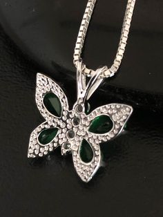 "Minimalist & Dainty Sterling Silver CZ Emerald Butterfly Necklace NECKLACE FEATURES: Metal: All components are made from solid .925 Sterling Silver Model is wearing 16\" in length solid .925 Sterling Silver Chain Length available: 16\", 18\" or 20\" Stone: CZ Emerald Butterfly Pendant Measurements: Height 18MM (0.7 Inches), including bail Width 16MM (0.6 Inches) Your Emerald Butterfly Necklace will arrive in a gift box, beautifully wrapped and ready for gifting Please send me a convo if you Green Necklaces With Rhinestones As Gift, Green Rhinestone Necklace For Gift, Emerald Butterfly, Beaded Ankle Bracelets, Necklace Butterfly, Heart Anklet, Beaded Ankle, May Birthstone, Emerald Necklace