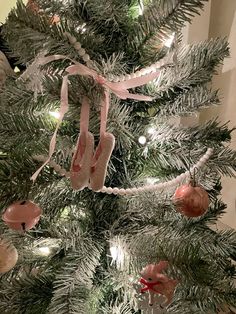 a christmas tree decorated with pink and white ornaments