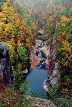 an instagram page with the image of a river in fall colors and trees surrounding it