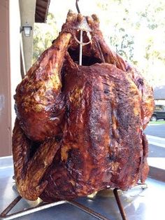 a large piece of meat is hanging from a rack