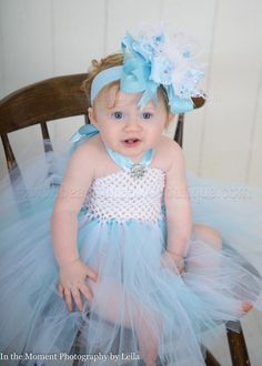 "This listing is for a Cinderella Inspired Light Blue and White tutu tulle dress with a satin halter tie as pictured for newborns, babies, and toddlers. Bow and Headband Set is optional. ITEM DETAILS: -Tutu skirt is double layered for extra fluff -Dress top stretches from 12\" - 20\" around and is 6\" long. -Hair Bow and Headband are optional -White Lace Bloomers are optional -Perfect for a Cinderella themed party or Halloween costume. Please convo me with any questions or if you need to purchas Fitted Light Blue Tulle Princess Dress, Light Blue Tutu Dress For Spring Baptism, Fitted Light Blue Tutu Dress For Party, Fitted Light Blue Tutu Dress For Wedding, Light Blue Fitted Tutu Dress For Wedding, Light Blue Princess Tutu Dress For Baptism, Fitted Tulle Tutu Dress For Baptism, Fitted Blue Tutu Dress For Pageant, Blue Tulle Tutu Dress For Pageant