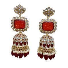 The Maroon Jiya Earrings are unique, and lightweight Jhumkas with Kundan, Meenakari and Gold-Plating on beautiful hydro beads. Specifications Materials used: Kundan, Meenakari, hydro beads, Gold Plating Weight: 41 g Height: 3.5 inches At Romikas, we pride ourselves on the craftsmanship and high quality of our jewelry, designed to enhance your natural beauty. Please contact us with any questions. Heavy Multicolor Earrings For Puja, Traditional Heavy Earrings For Puja, Fusion Style Festive Chandbalis With Latkans, Festive Fusion Chandbalis With Latkans, Fusion Kundan Jhumkas With Meenakari, Fusion Style Kundan Jhumkas With Meenakari, Festive Fusion Kundan Jhumkas, Fusion Style Kundan Danglers For Festivals, Fusion Kundan Danglers For Festivals