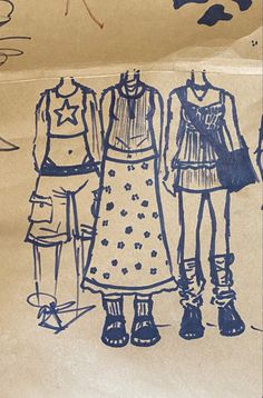 three children's clothes are drawn on paper