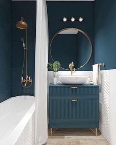 a bathroom with blue walls and gold fixtures in the bathtub, sink, and shower