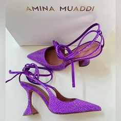 These Purple Amina Muaddi Karma 95 Crystal Suede Pumps Feature A Pointed Toe, Sculpted 95 Mm Heel, All-Over Embellishments, Branded Leather Insole And Slingback Strap With Ankle Tie Detailing. If Our Actions Determine Our Future Fate, We're On Our Best Behaviour. We're After Some Good Karma By Way Of These Amina Muaddi Pumps, Please. This Piece Fits True To Size. We Recommend You Select Your Regular Size. Luxury Purple Heels, Mach Mach Shoes Purple, Amina Muaddi Purple Heels, Hand Embellished Heels For Evening, Hand Embellished Heels For Party, Purple Crystal Embellished Heels For Evening, Purple Crystal Embellished Evening Heels, Embellished Purple Heels For Evening, Chic Embellished Purple Heels