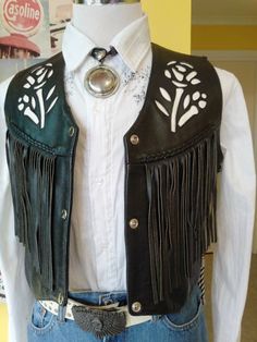 "Great condition, motorcycle vest with floral inlay top stitched design Leather is Firm to service its purpose. Measurements: Across Shoulders 15\" Shoulder Seams 4.5\" Wide Bust - Chest 38\" Length, Shoulder Seams to Waist at Longest Point - 21\" Fringing Back and Front 8\" Long Two Front Pockets 5\" Wide x 5\" Deep V-Neckline 10\" Deep" Biker Style Fitted Vest For Festivals, Fitted Biker Vest For Festivals, Cowboy Vest, Badass Outfit, Western Vest, Motorcycle Vest, Vest Outfits, Leather Vest, Historical Clothing