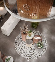 an aerial view of a living room and dining area with tables, chairs, and potted plants