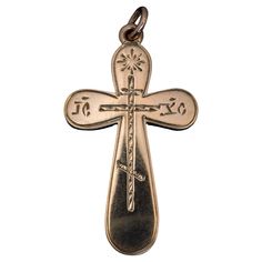 This antique Russian 14K rose gold cross pendant with hand-engraved decorations was made in St. Petersburg between 1899 and 1903. The abbreviation ‘IC’ – ‘XC’ on the horizontal arms of the cross stands for Jesus Christ. The cross is marked with 56 zolotnik old Russian gold standard with initials ‘ЯЛ’ for St. Petersburg assay master Yakov Liapunov (1899-1903) and maker’s initials ‘PB’ for Rudolf Weide, a prominent jeweler of the period. The cross measures (without suspension ring) 39 x 22 mm (1 1 Engraved Cross, Jesus Christus, Gold Cross Pendant, Gold Cross, Hand Engraving, St Petersburg, Cross Pendant, Or Rose, Jesus Christ