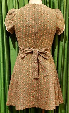 1970’s green floral smocked dolly mini dress by Jody T.Ties on the back.Overall good condition but does show sign of wear slight pilling overall. Patchwork Baby, Dusty Green, Floral Lace Dress, Burgundy Floral, Prairie Dress, Floral Sleeveless, Babydoll Dress, Vintage Boutique, Holiday Dresses