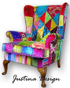 an upholstered chair with colorful fabrics on it