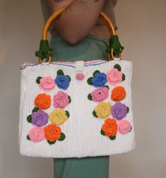 Discover the charm of handmade craftsmanship with our Colorful Flower Knit Tote Bag. A perfect blend of style and functionality, this white knitted purse features a vibrant array of hand-stitched floral designs, making it a unique addition to your spring and summer wardrobe. Perfect Gift Idea: Looking for a unique gift? Our Handmade Knit Tote Bag is an excellent choice for birthdays, anniversaries, or as a special treat for yourself. It's not just a bag; it's a piece of wearable art. Eco-Friendl Summer Fashion Accessories, Knitting Tote, Knitting Tote Bag, Floral Knit, Tote Bags Handmade, Handmade Knitting, Hand Stitching, Colorful Flowers, Wearable Art