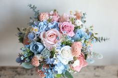 a bouquet of flowers sitting on top of a table