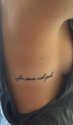 the back of a woman's stomach with an inscription on it that says, you are