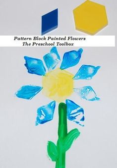 a paper flower with blue and yellow flowers painted on it