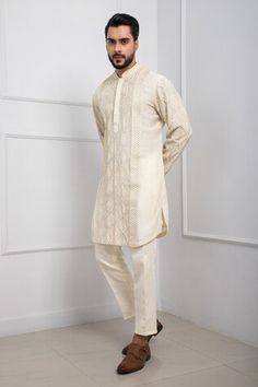 Ivory kurta with thread, beads embroidery in geometric pattern. Paired with coordinating pant. - Aza Fashions White Cotton Kurta With Geometric Embroidery, Transitional Cotton Kurta With Geometric Embroidery, Traditional Straight Kurta With Geometric Embroidery, Traditional Kurta With Geometric Embroidery For Eid, Traditional Fitted Kurta With Geometric Embroidery, Traditional Sets With Geometric Embroidery For Transitional Season, Geometric Embroidered Kurta For Eid Wedding, Elegant Festive Kurta With Geometric Embroidery, Traditional Long Sleeve Sherwani With Geometric Embroidery