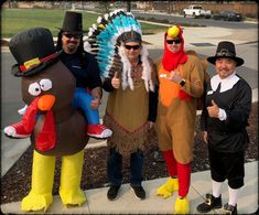 three people dressed up in thanksgiving costumes posing for a photo with turkey and turkey man