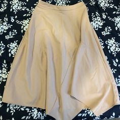 Selling Brand New Zara Midi Skirt In Nude. Tags Still On. It’s Asymmetrical And Has Beautiful Creases For A Flattering Look. Can Be Dressed Up Or Down! Beige Asymmetrical Bottoms For Work, Flattering Midi Skirt For Summer, Asymmetrical Beige Bottoms For Work, Chic Spring Lined Draped Skirt, Spring Pleated Maxi Skirt With Asymmetrical Hem, Beige Asymmetrical Maxi Skirt For Spring, Asymmetrical Flowy Skirt In Solid Color, Chic Asymmetrical Solid Skirt, Spring Asymmetrical Hem Pleated Maxi Skirt