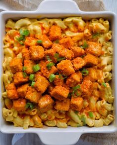 a casserole dish with cauliflower and green onions