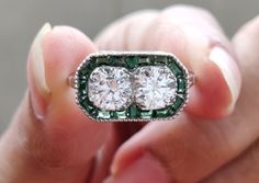 💍 𝐈𝐭𝐞𝐦 𝐃𝐞𝐬𝐜𝐫𝐢𝐩𝐭𝐢𝐨𝐧 💍 Unique 925 Sterling Silver & Moissanite Vintage Toi et Moi Engagement Ring For Women. Green Emerald Baguette Enhance Art Deco Ring Look. Best For Mothers day Gift. Best Gift Idea. Gelson World. 💍 𝐌𝐄𝐓𝐀𝐋 💍 ✶ Solid 925 Sterling Silver ✶ Rhodium Plated 💍 𝐌𝐀𝐈𝐍 𝐒𝐓𝐎𝐍𝐄 💍 ✶ Stone Shape : Round Cut ✶ Stone Type : Cubic Zirconia ( CZ ) Or Moissanite (Select From Drop Down Menu) ✶ Stone Size : 6 MM (Each) ✶ Carat Weight : 1.60 Ct ✶  CZ Color : D / Whit Toi Et Moi Ring Emerald And Diamond, Toi Et Moi Emerald And Diamond, May Birthstone Gift, Art Deco Emerald Ring, Art Deco Toi Et Moi Ring, Art Deco Green Emerald Multi-stone Ring, Antique Rings Vintage, Engagement Ring Antique, Jewelry Emerald, Rings Vintage