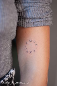 a woman's arm with the words mom and baby written on it in small letters