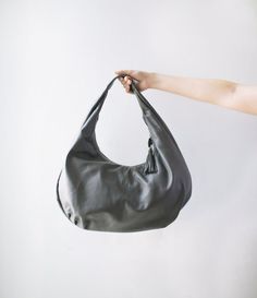 "Please read our shipping terms and conditions before placing an order : https://www.etsy.com/listing/1079992551/must-read-alus-indonesia-shipping-terms This is our medium size hobo bag. Choose your own color for a bag that holds your shoulder effortlessly and can take all your necessary everyday items. This bag is made of a fine quality supple genuine lamb skin that slouches nicely for hobo look. Leather is durable, doesn't wrinkle much and comes in a large variety colors and styles. Perfect fo Gray Hobo Shoulder Bag, Gray Hobo Shoulder Bag For Everyday Use, Gray Everyday Hobo Shoulder Bag, Gray Leather Hobo Bag For Daily Use, Gray Soft Leather Shoulder Bag For Daily Use, Gray Leather Hobo Shoulder Bag, Gray Leather Hobo Bag For Everyday Use, Gray Soft Leather Tote Shoulder Bag, Gray Soft Leather Shoulder Bag For Everyday