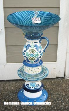 a blue and white vase sitting on top of a stand in front of a door