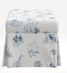 an elephant and giraffe print bed skirt with matching footstool, made from 100 % cotton