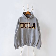 90s University of California UCLA hoodie/ XL * PLEASE READ BEFORE PURCHASE * PLEASE consider the PHOTOS before making the decision * The images may DIFFER in appearance from the actual product because we took pictures under daylight.  * PLEASE send your PHONE NUMBER after your purchase for the shipping company to contact you X No returns X No refund Condition : 9/10 More details : look at the pictures  Brand : Russell Size : XL Pit to pit/ Chests : 26/52 inches  Length : 28.5 inches  Material : Ucla Hoodie, Ucla University, Hoodie Allen, Shipping Company, University Of California, White Hoodie, Favorite Outfit, Gender Neutral, Thailand