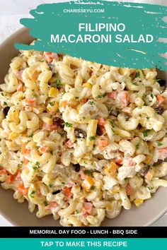 a white bowl filled with macaroni salad on top of a blue and green background