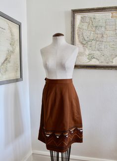 "Beautiful and unique vintage skirt, hand-sewn locally in St. Louis - estimated 1970s/80s. This skirt is in excellent vintage condition, there is some noted wear around the side zipper, as well as pilling. Estimated size S/M. Please see measurements for accurate fit: Length: 24\" Waist: 25\" Hips: 38\" Please message me with any questions about this item. Thank you for visiting BugB! v i n t a g e b o t t o m s https://www.etsy.com/shop/BugBVintage?section_id=26872169 v i s i t t h e s h o p www Vintage Knee-length Brown Skirt, Vintage Brown Knee-length Skirt, Vintage Fitted Cotton Skirt, Fitted Vintage Mini Skirt, Vintage Knee-length Lined Skirt, Vintage Pleated Mini Skirt, Fitted Vintage Skirt For Vintage Fashion, Retro Brown Flared Skirt, Vintage Cotton Lined Skirt