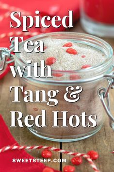 spiced tea with tang and red hots in a glass jar on a wooden table