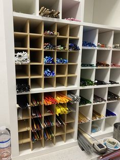 the shelves are filled with many different colored items