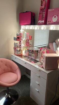 a pink chair sits in front of a vanity with makeup and cosmetics items on it