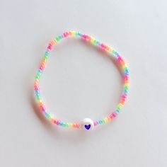 Cute elastic beaded bracelet made with shiny rainbow pearls Trendy Rainbow Beaded Bracelets, Iridescent Beaded Bracelets With Colorful Beads As Gift, Rainbow Round Beads Stretch Bracelet For Friendship, Iridescent Beaded Bracelets As Gift, Iridescent Beaded Bracelets With Colorful Beads, Casual Rainbow Stretch Bracelet With Round Beads, Adjustable Iridescent Beaded Stretch Bracelet, Pastel Jewellery, Pastel Jewelry