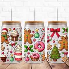 three christmas themed can coolers on a wooden table