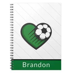 a spiral notebook with a soccer ball in the shape of a heart and name brandon