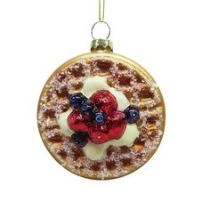 a waffle christmas ornament with blueberries and raspberries